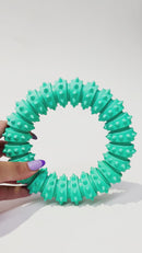 Close-up of the textured surface on the Rubber Dental Dog Ring Toy