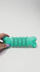Pet owner holding the Rubber Dental Bone, highlighting its large size and easy-to-grip design for interactive play
